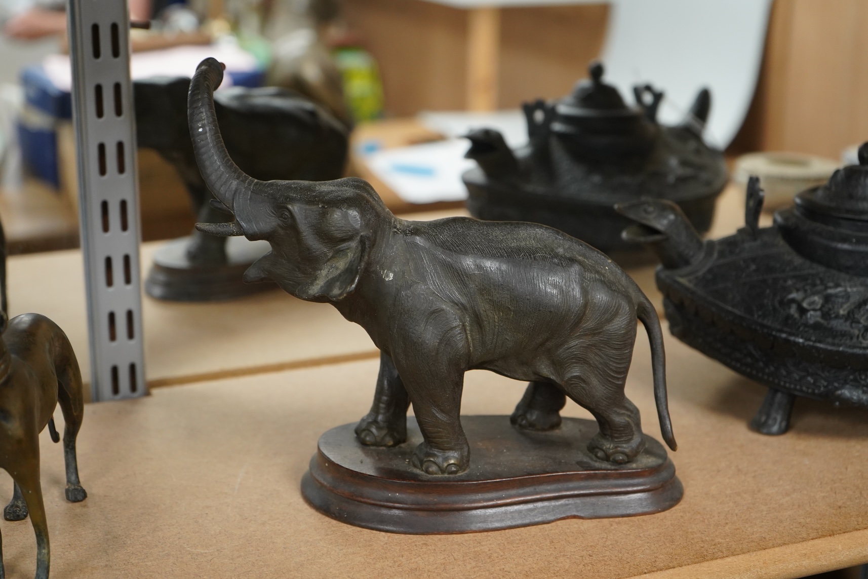 A bronzed metal model of an elephant and a bronze model of a greyhound, tallest 20cm